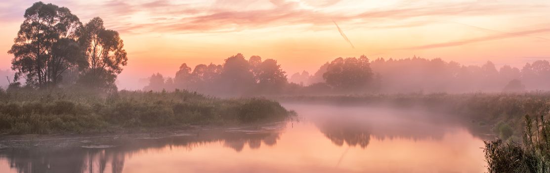 Foggy river in the morning. Panorama