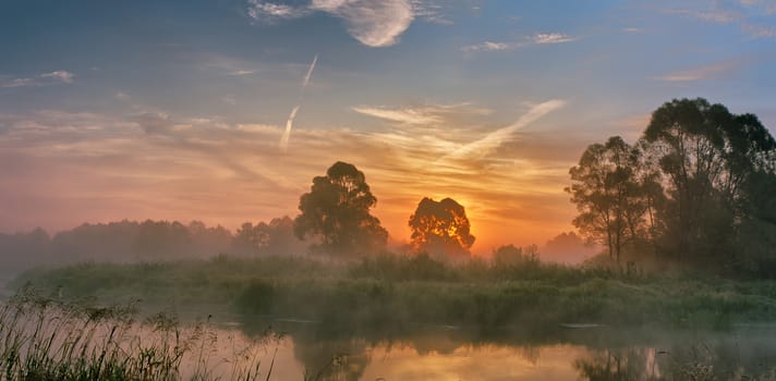 Foggy river in the morning. Panorama