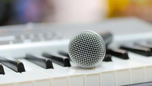 Close-up classical microphone on electronic keyboard 