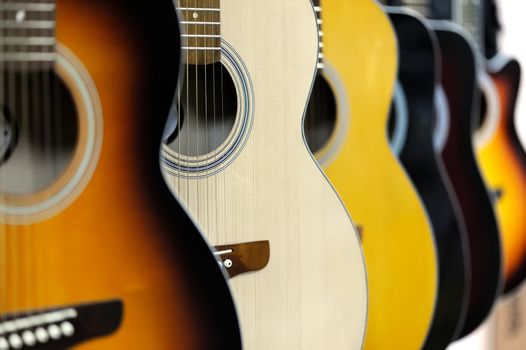 Guitars a row in the store background