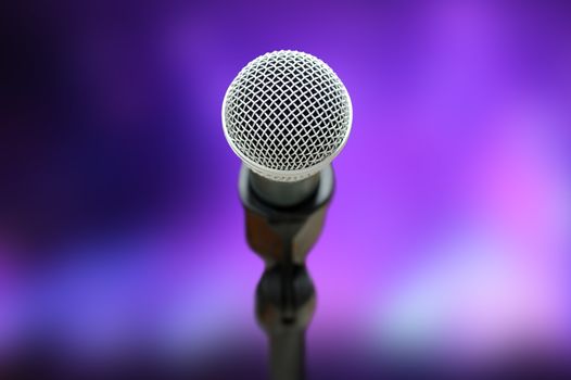 Close-up of microphone in concert hall or conference room