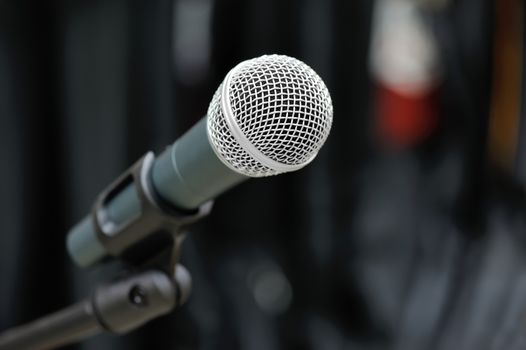 Close-up of microphone in concert hall or conference room