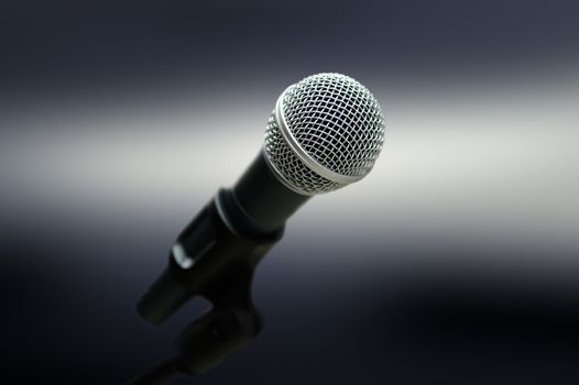 Close-up of microphone in concert hall or conference room