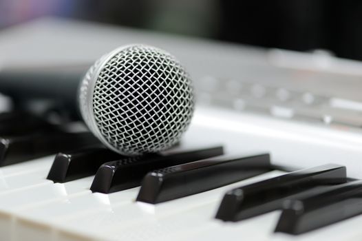 Close-up classical microphone on electronic keyboard 