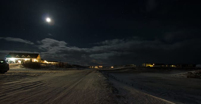 Moonlight over northern Iceland village of Mývatn during winter.