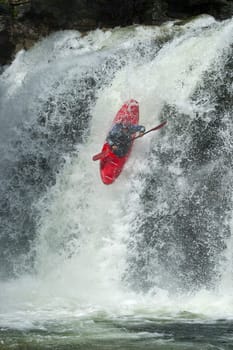Kayaker in the waterfall in Norway, Ula river.