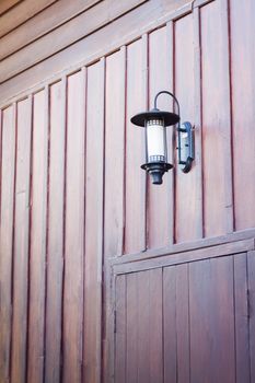 Lamp decorated on wooden wall, stock photo