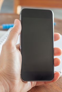 Smart phone in a woman's hand, stock photo