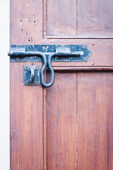 Closeup vintage wooden door locked , stock photo