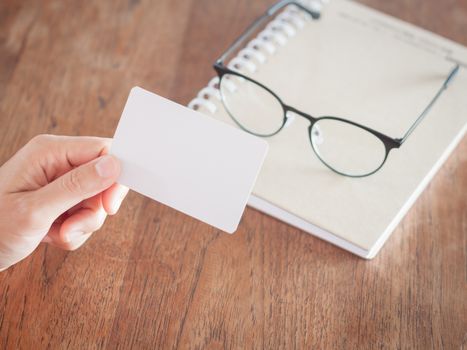 Woman hold blank business cards, stock photo