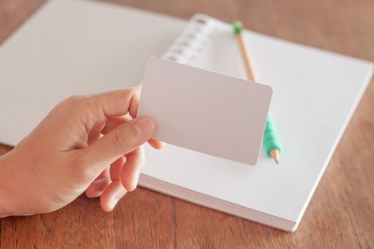 Woman hold blank business cards, stock photo