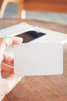 Woman hold blank business cards, stock photo