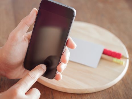 Smart phone in a woman's hand, stock photo