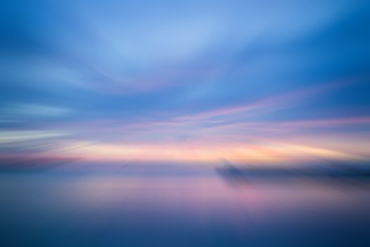 Sunset in the sea with radial blur background, stock photo