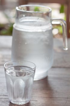Glass of cold water with jar, stock photo