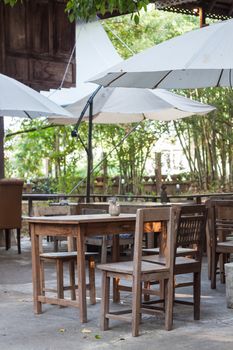 Wooden furniture decorated in garden, stock photo