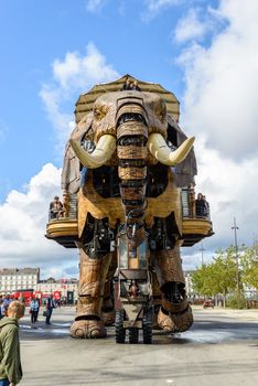 NANTES, FRANCE - CIRCA SEPTEMBER 2015: The Great Elephant goes for a walk with passengers aboard.