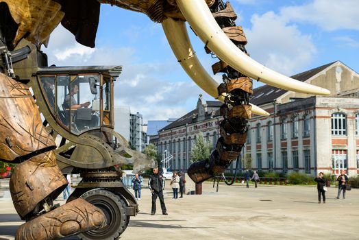 NANTES, FRANCE - CIRCA SEPTEMBER 2015: The Great Elephant goes for a walk with passengers aboard.