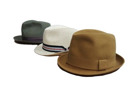 three colored men's hats. on a white background