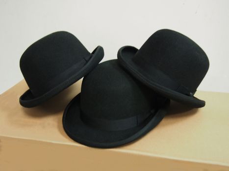 three colored men's hats. on a white background