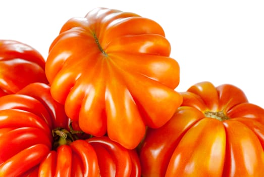 a few fresh tomatoes, isolated on white background, selective focus