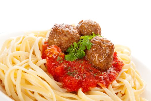 Pasta with tomato sauce and meatballs. Traditional mediterranean eating. 
