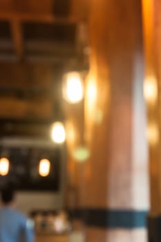 Warm lighting lamps on ceiling in coffee shop, stock photo