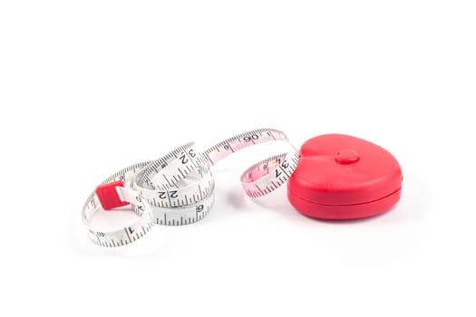 Measuring tape in heart shape on white background, stock photo