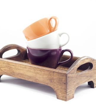 Coffee cups on wooden tray isolated on white background, stock photo