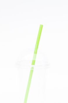 Empty plastic cup with straw isolated on white background, stock photo