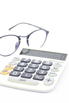 Calculator with eyeglasses isolated on white background, stock photo