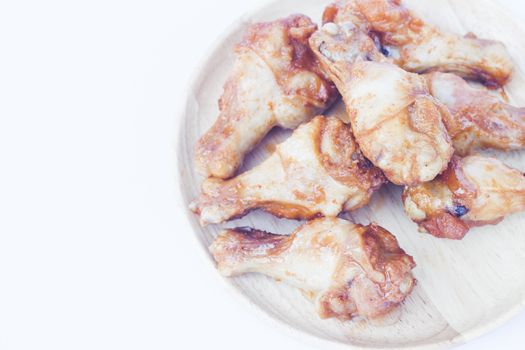 Grilled chicken wings isolated on white background, stock photo