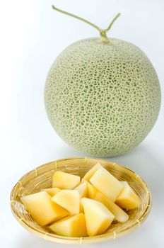 freshly cut cantaloupe melon on white background