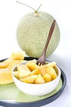 freshly cut cantaloupe melon on white background