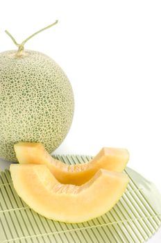 freshly cut cantaloupe melon on white background
