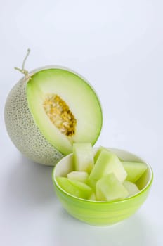 shopped green melon isolated on white background