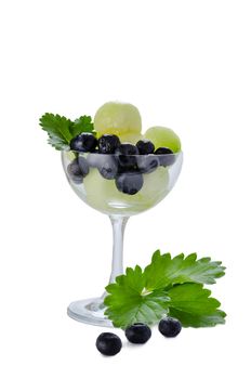 Fresh forest berries and melon  in a glass on a white background isolated