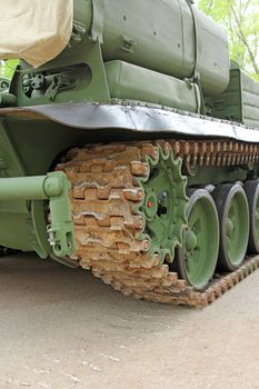 Part of the undercarriage of tracked military equipment, close-up