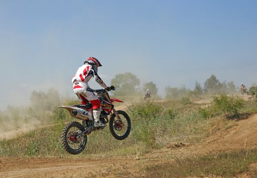 ARSENYEV, RUSSIA - AUG 30: Rider participates in the round of the 2014 Russia motocross championship on August 30, 2014 in Arsenyev, Russia.