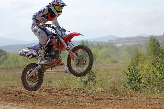 ARSENYEV, RUSSIA - AUG 30: Rider participates in the round of the 2014 Russia motocross championship on August 30, 2014 in Arsenyev, Russia.