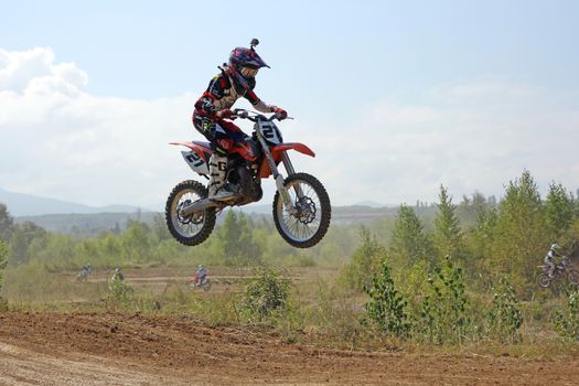 ARSENYEV, RUSSIA - AUG 30: Rider participates in the round of the 2014 Russia motocross championship on August 30, 2014 in Arsenyev, Russia.