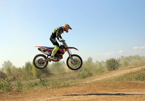 ARSENYEV, RUSSIA - AUG 30: Rider participates in the round of the 2014 Russia motocross championship on August 30, 2014 in Arsenyev, Russia.