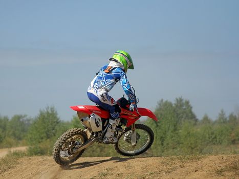 ARSENYEV, RUSSIA - AUG 30: Rider participates in the round of the 2014 Russia motocross championship on August 30, 2014 in Arsenyev, Russia.