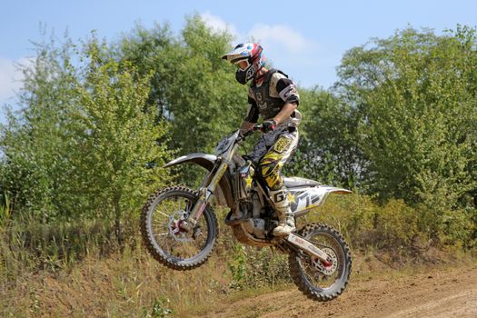 ARSENYEV, RUSSIA - AUG 30: Rider participates in the round of the 2014 Russia motocross championship on August 30, 2014 in Arsenyev, Russia.