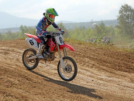 ARSENYEV, RUSSIA - AUG 30: Rider participates in the round of the 2014 Russia motocross championship on August 30, 2014 in Arsenyev, Russia.