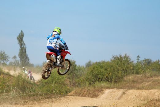 ARSENYEV, RUSSIA - AUG 30: Rider participates in the round of the 2014 Russia motocross championship on August 30, 2014 in Arsenyev, Russia.