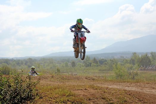 ARSENYEV, RUSSIA - AUG 30: Rider participates in the round of the 2014 Russia motocross championship on August 30, 2014 in Arsenyev, Russia.