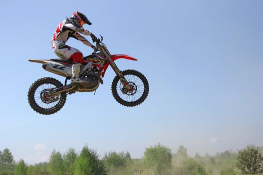 ARSENYEV, RUSSIA - AUG 30: Rider participates in the round of the 2014 Russia motocross championship on August 30, 2014 in Arsenyev, Russia.