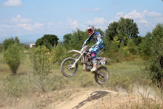 ARSENYEV, RUSSIA - AUG 30: Rider participates in the round of the 2014 Russia motocross championship on August 30, 2014 in Arsenyev, Russia.