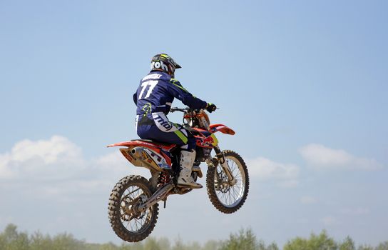 ARSENYEV, RUSSIA - AUG 30: Rider participates in the round of the 2014 Russia motocross championship on August 30, 2014 in Arsenyev, Russia.